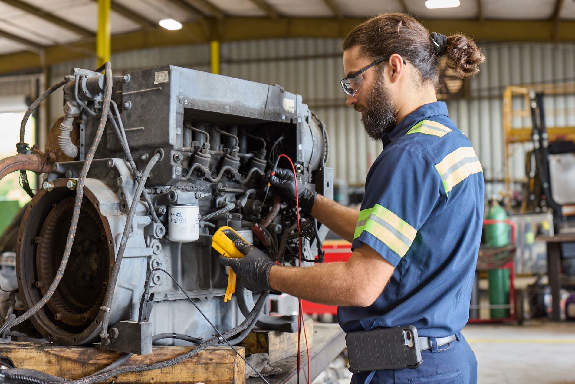 Cox employee working on a car