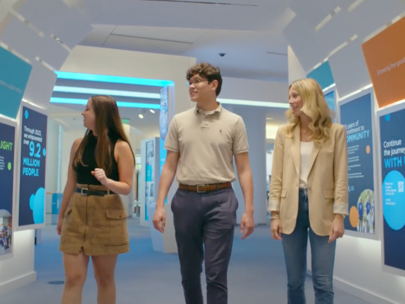 a group of people walking in a room
