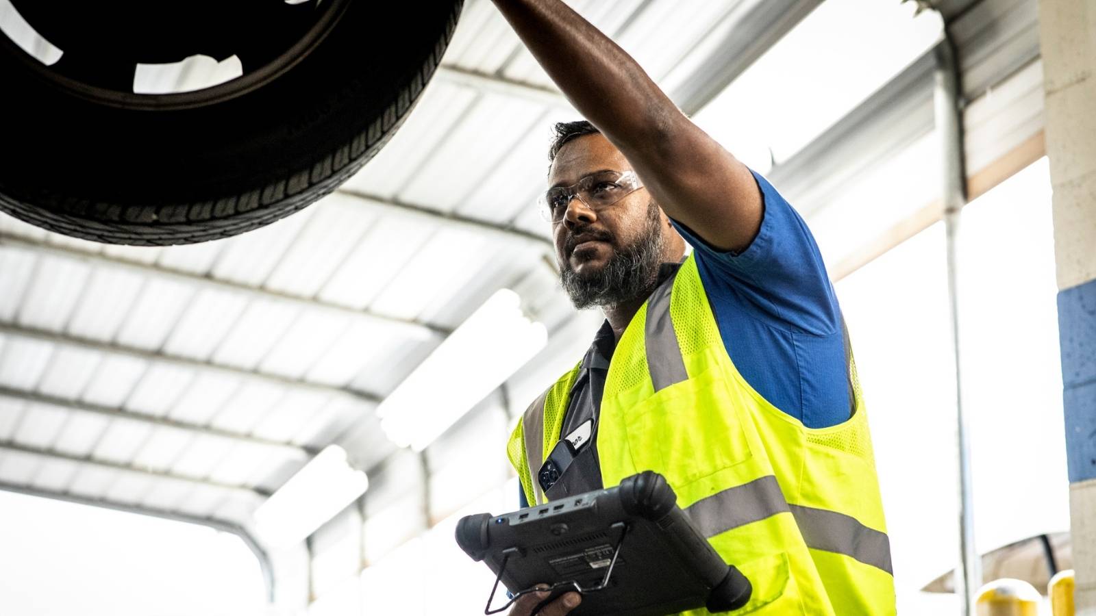 Cox auto technician fixing car