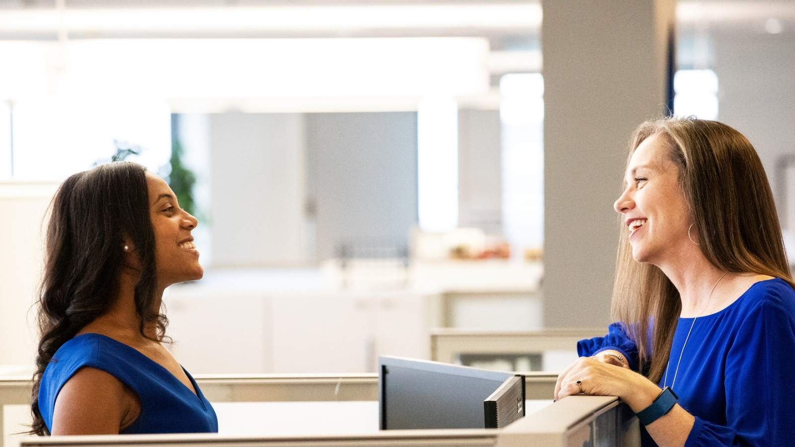 a couple of women looking at each other