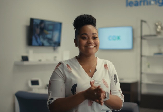Cox employee smiling at the camera