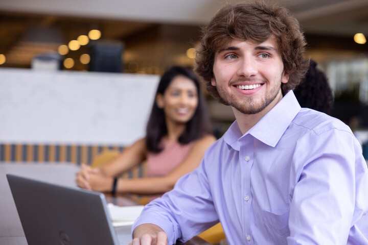 a Cox employee smiling at camera