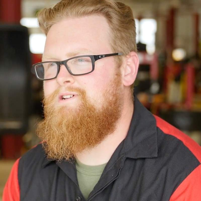 a person with a beard and glasses