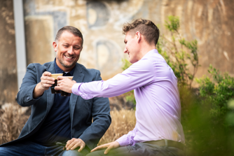 Two people drinking coffee smiling