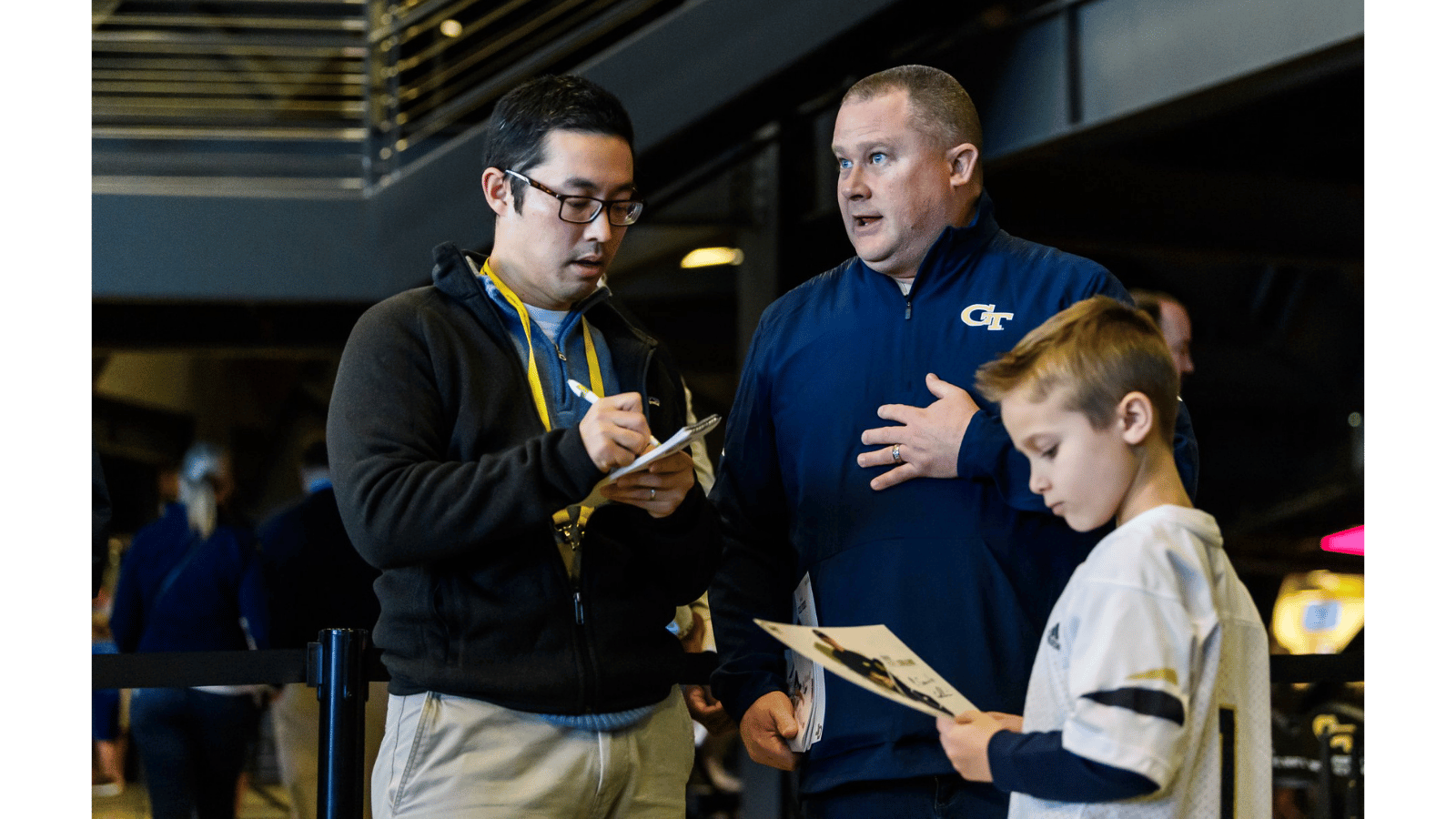 An AJC employee taking notes during an interview