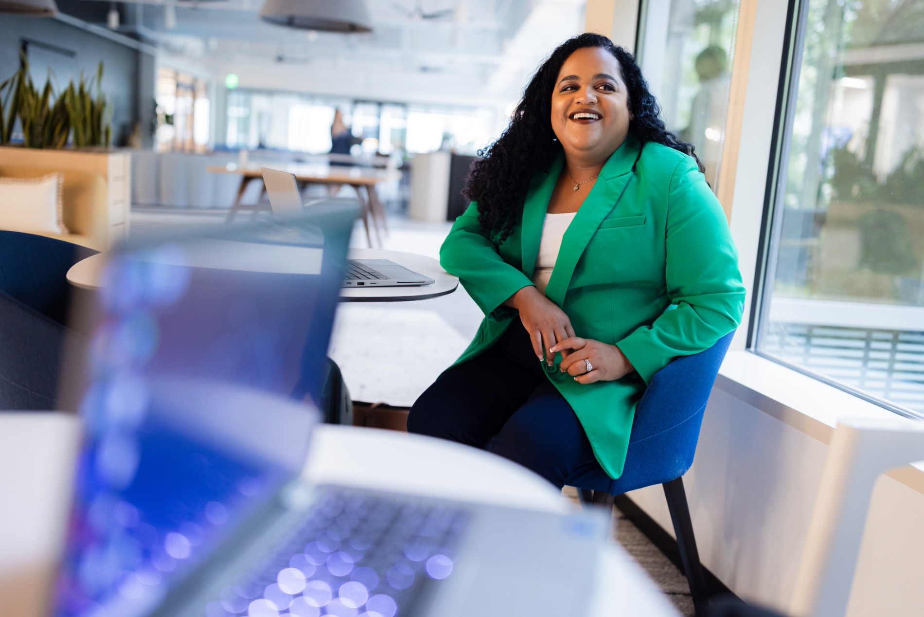 Cox employee sitting at a table