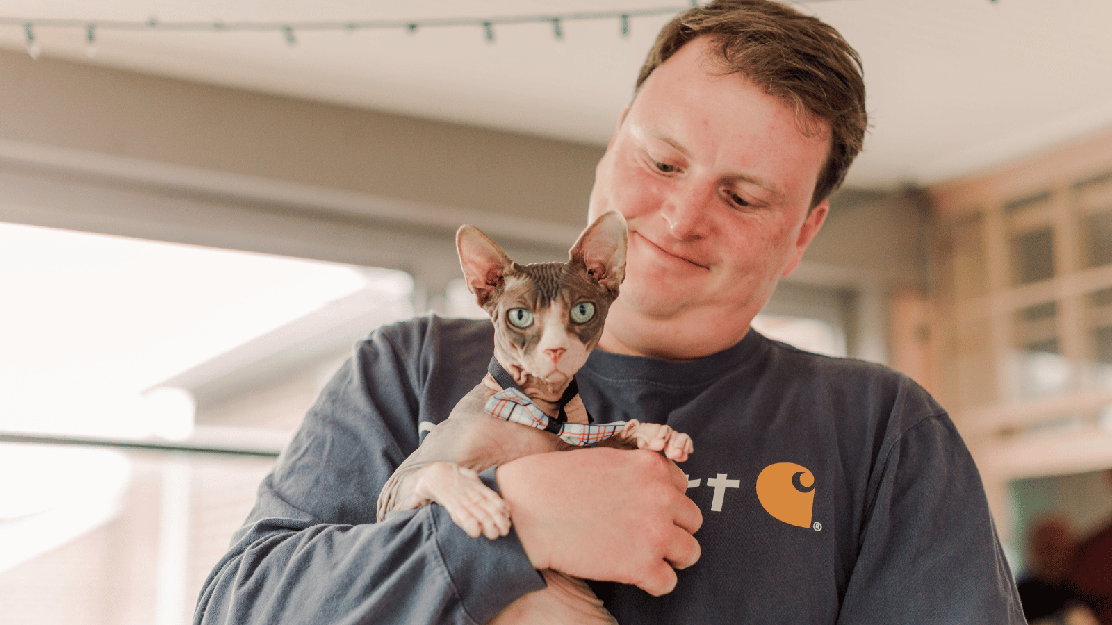 Chris Carey Cox employee with his cat