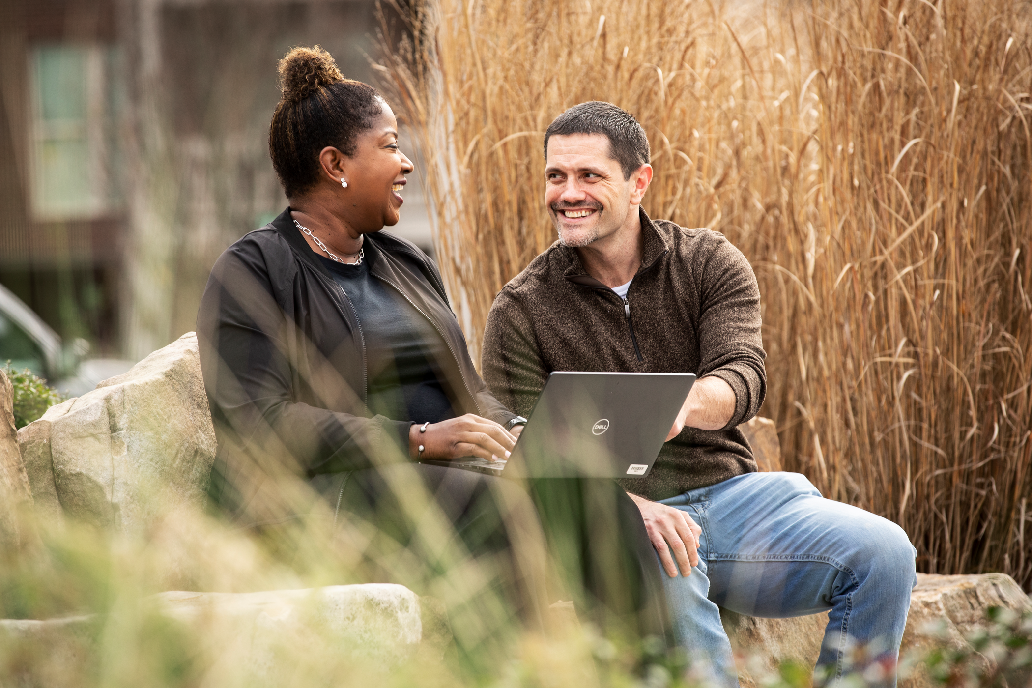 Cox employees collaborating outside