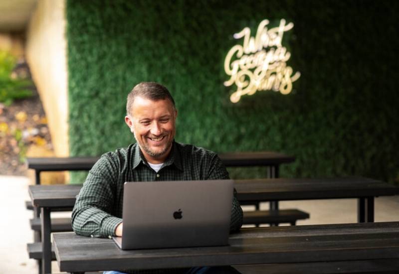 Person typing on laptop