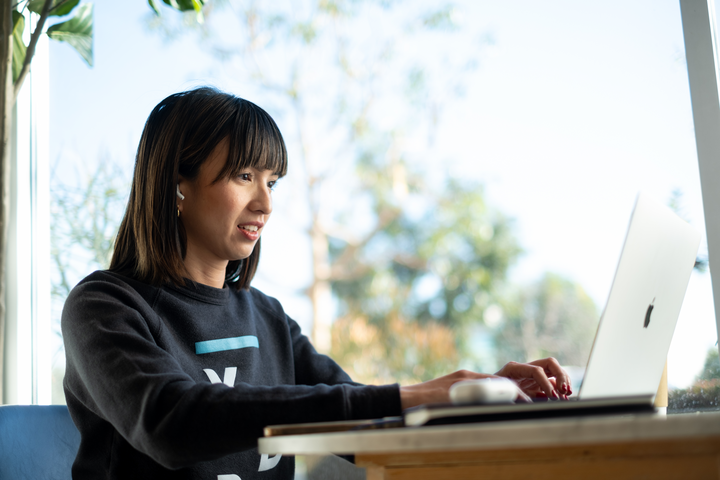 Cox employee on laptop